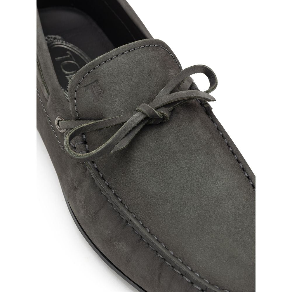Gray nubuck leather moccasin by Tod's featuring classic stitching and slip-on design.