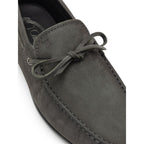 Gray nubuck leather moccasin by Tod's featuring classic stitching and slip-on design.