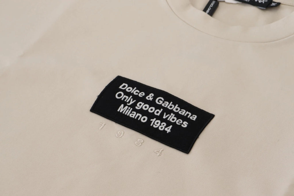 Dolce & Gabbana ivory cotton crewneck sweatshirt with printed design, showcasing a stylish, casual men's or women's top.