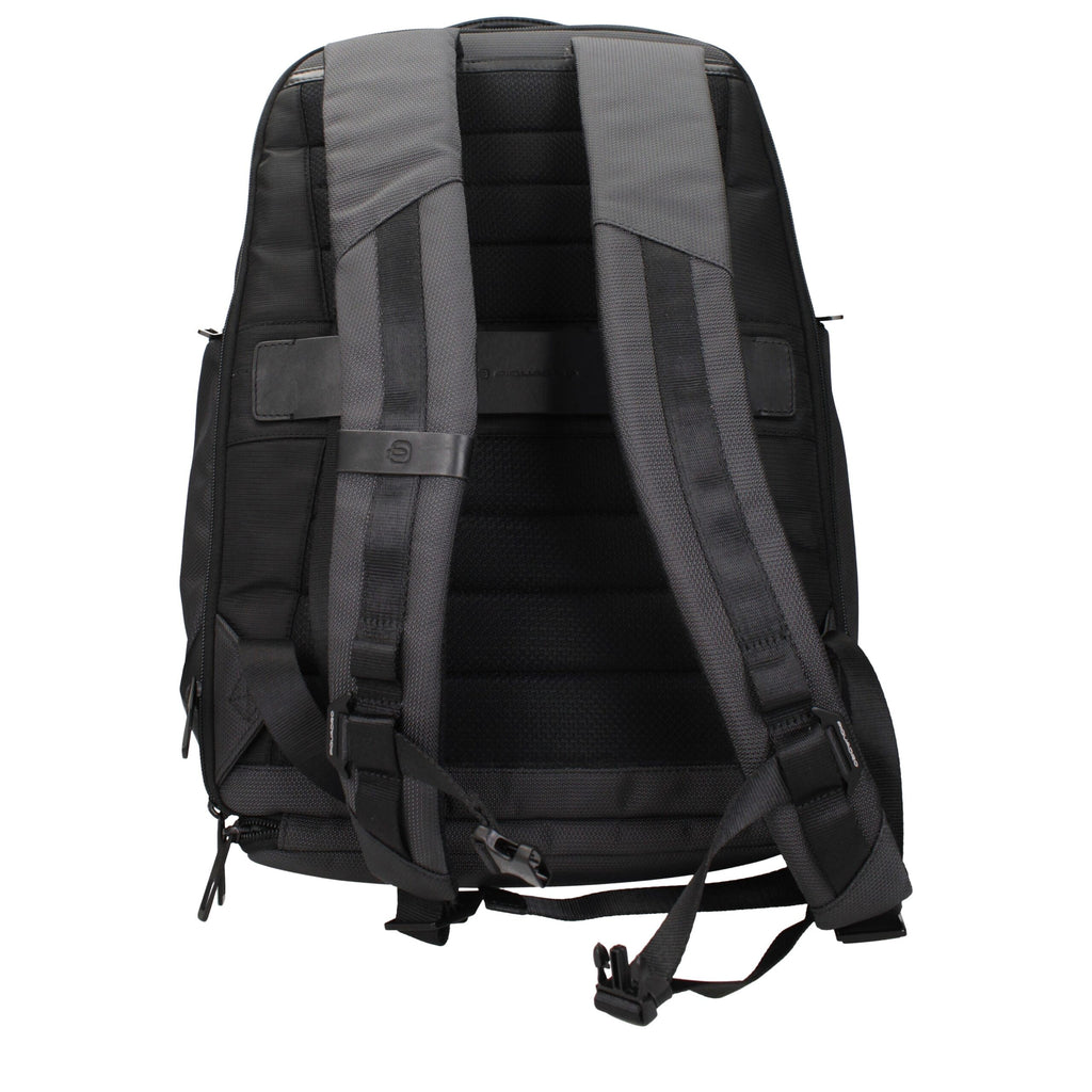 Piquadro gray fabric backpack with adjustable straps and multiple compartments, designed for everyday use and travel.