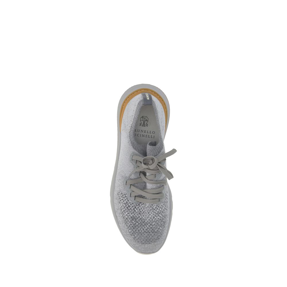 Brunello Cucinelli gray cotton athletic sneakers with white soles and lace-up design, casual footwear for active wear.