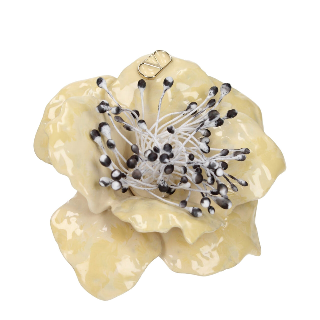 Valentino Garavani beige metal brooch with intricate design, showcasing elegant craftsmanship and vintage-inspired details.