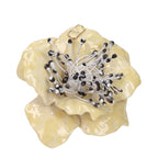 Valentino Garavani beige metal brooch with intricate design, showcasing elegant craftsmanship and vintage-inspired details.