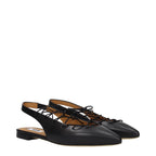 Black leather flats by Moschino featuring a sleek design and classic silhouette, perfect for casual or dressy occasions.