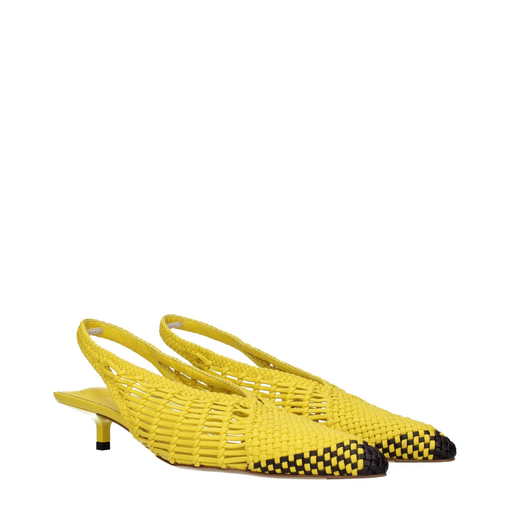 Yellow leather flat sandals by Jacquemus featuring minimalist design and ankle strap, perfect for casual summer wear.