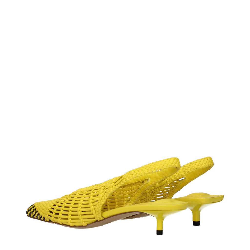 Jacquemus yellow leather flat sandals with open toe design and ankle straps, stylish summer footwear for women.