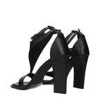 Max Mara black leather stiletto heel sandals with open toes and ankle straps, stylish women's footwear.