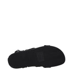 Black leather flat sandals by Isabel Marant with minimalist design and slim straps, perfect for casual and chic summer outfits.
