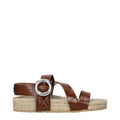 Brown leather flat sandals by Stella McCartney featuring minimalist design and sleek straps for casual elegance.