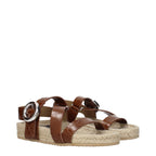 Stella McCartney brown leather flat sandals with minimalist design and open toe, showcasing their sleek, comfortable style.