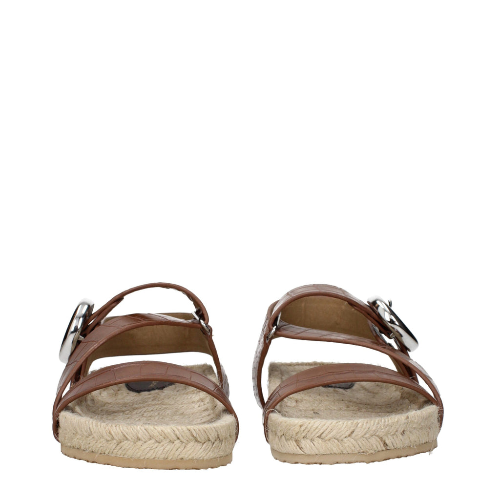 Brown leather flat sandals by Stella McCartney featuring minimalist design and open toe style.