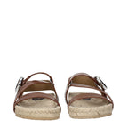 Brown leather flat sandals by Stella McCartney featuring minimalist design and open toe style.