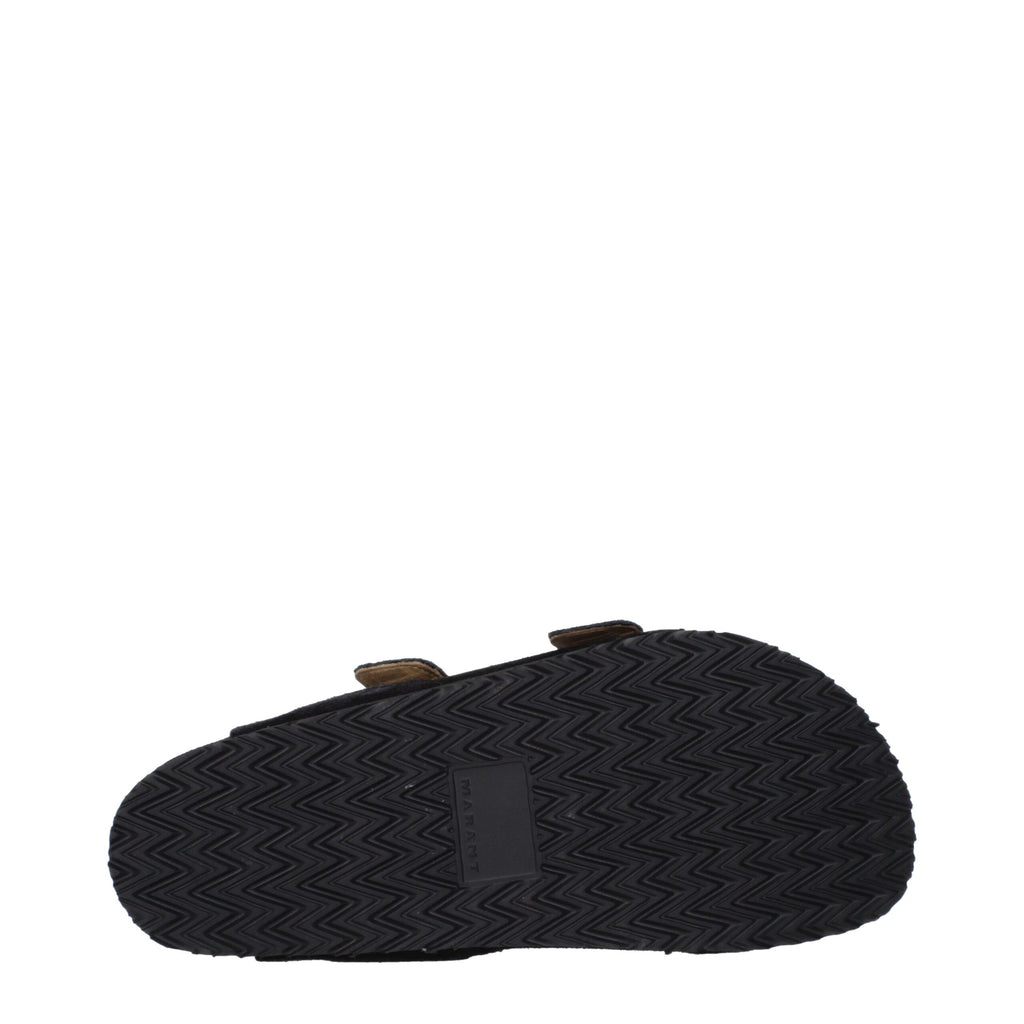 Black leather slippers by Isabel Marant featuring a sleek design and comfortable slip-on style.
