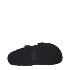 Black leather slippers by Isabel Marant featuring a sleek design and comfortable slip-on style.