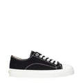 Black Moschino fabric low top sneakers with white rubber soles and minimal branding, stylish casual footwear for everyday wear.