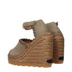 Stella McCartney green leather wedge sandals with ankle straps and open toe design on a neutral background.