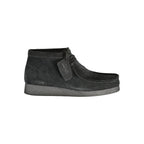 Clarks Nero leather men's sneaker with sleek design, white sole, and black laces, showcasing stylish casual footwear.