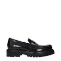Off-White black leather slip-on loafers with sleek design and minimal stitching, featuring a smooth finish and classic loafer style.