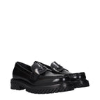 Off-White black leather slip-on loafers with sleek design and minimal stitching, showcasing their stylish and comfortable footwear.