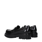 Off-White black leather slip-on loafers with sleek design and minimal detailing, showcasing smooth leather and comfortable fit.
