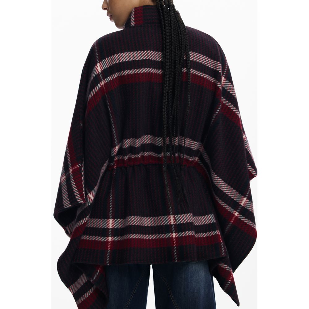 Black polyester women's poncho by Desigual, featuring a stylish, draped design with a loose fit and subtle brand detailing.