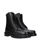 Off-White black leather ankle boots with sleek design, pointed toes, and subtle branding, perfect for modern fashion.