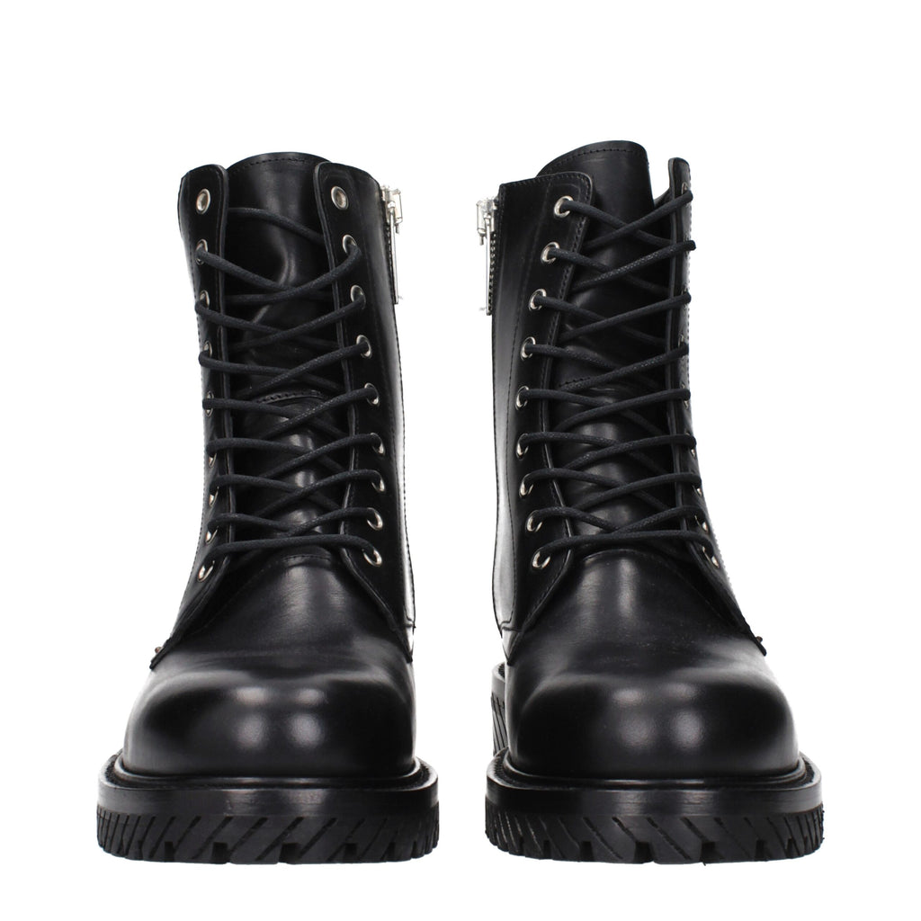 Off-White black leather ankle boots with sleek design and chunky soles, showcasing stylish footwear for modern fashion.