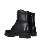 Off-White black leather ankle boots with sleek design and sturdy soles, featuring minimal branding and modern style.