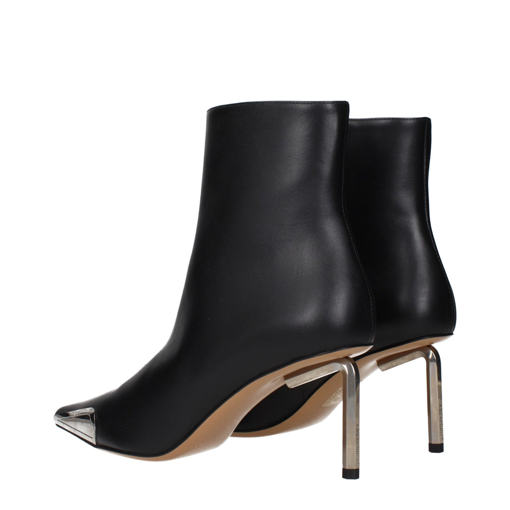 Off-White black leather ankle boots with sleek design, pointed toes, and chunky heels, perfect for stylish footwear.