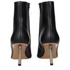 Off-White black leather ankle boots with sleek design and pointed toes, stylish footwear for modern fashion.