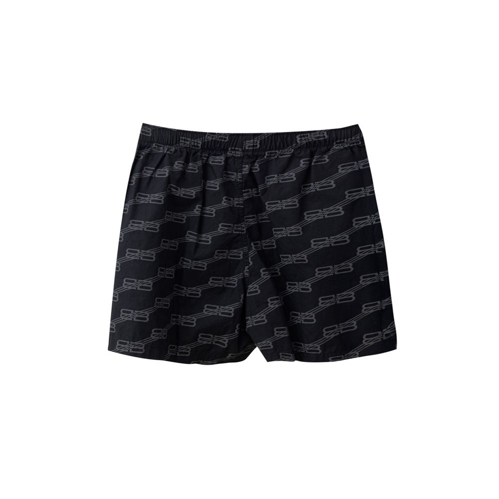 Black cotton Bermuda shorts by Balenciaga featuring a relaxed fit and minimalist design, shown on a plain background.