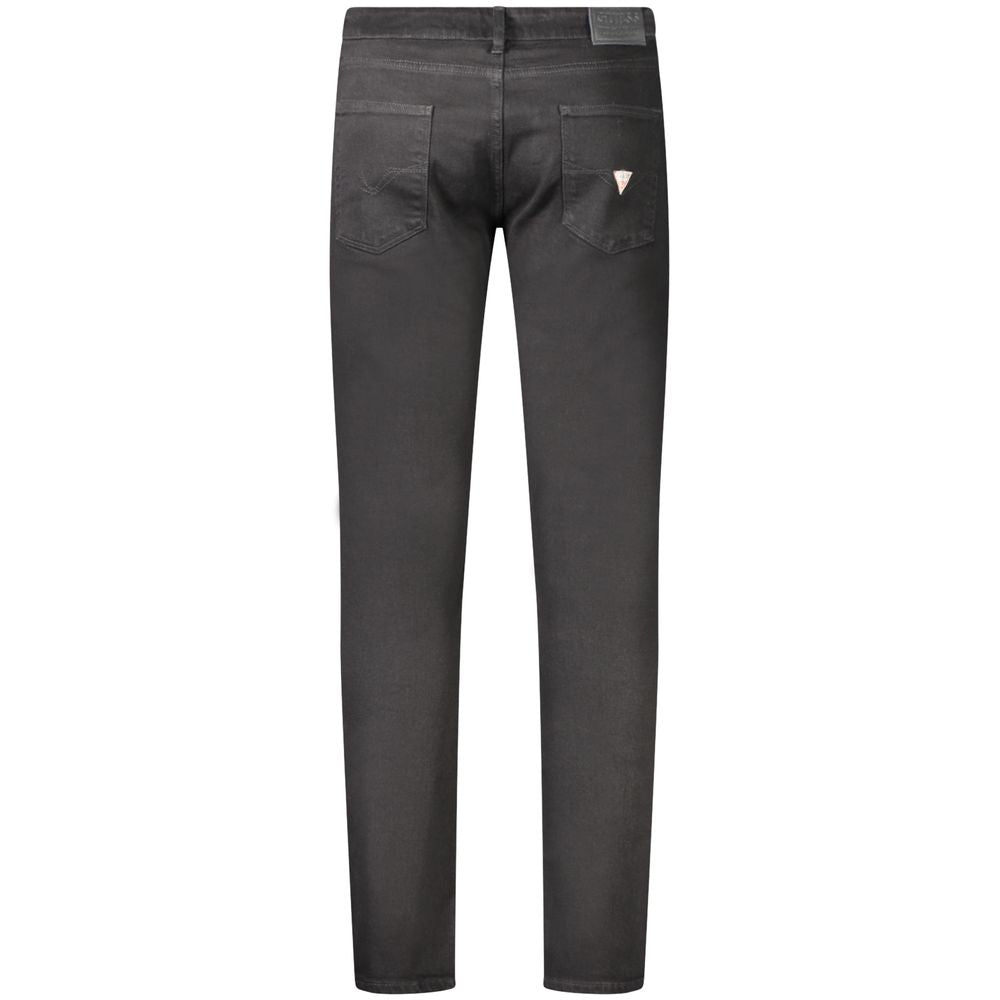 Black Guess Jeans men's skinny jeans made of cotton, displayed on a hanger with a fitted, slim silhouette.
