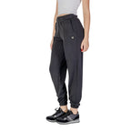 Guess Active black polyester joggers for women, featuring a sleek workout pant design with comfortable fit and subtle branding.