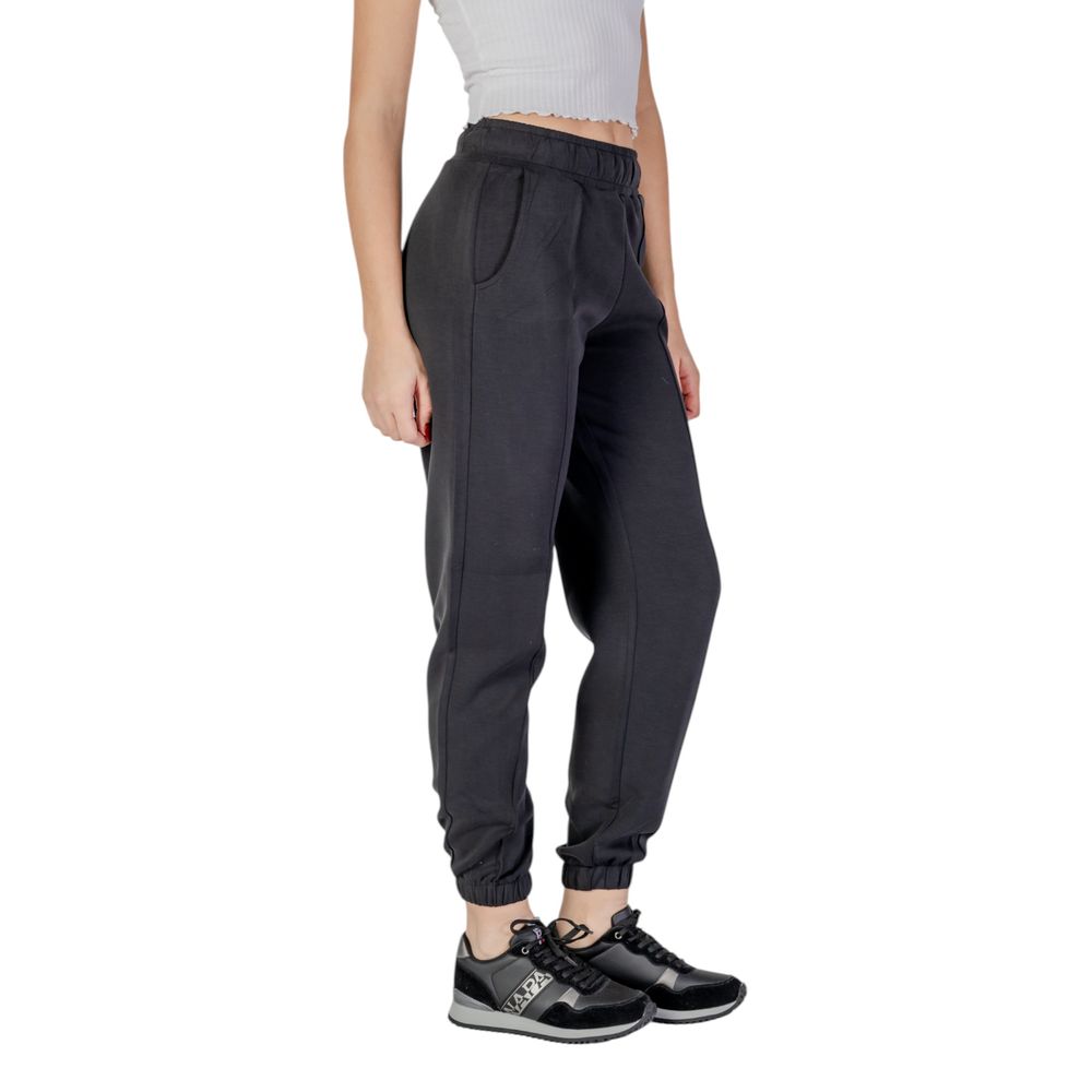 Guess Active black polyester joggers for workout, featuring a relaxed fit and athletic design with elastic waistband and tapered legs.
