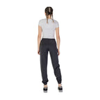Guess Active black polyester joggers for workout, featuring a tapered fit and elastic waistband, suitable for activewear and casual wear.