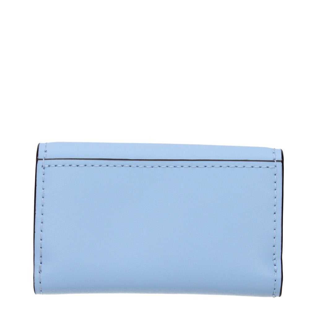 Light blue leather Michael Kors wallet with gold-tone accents, featuring multiple card slots and a sleek, compact design.