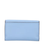 Light blue leather Michael Kors wallet with gold-tone accents, featuring multiple card slots and a sleek, compact design.