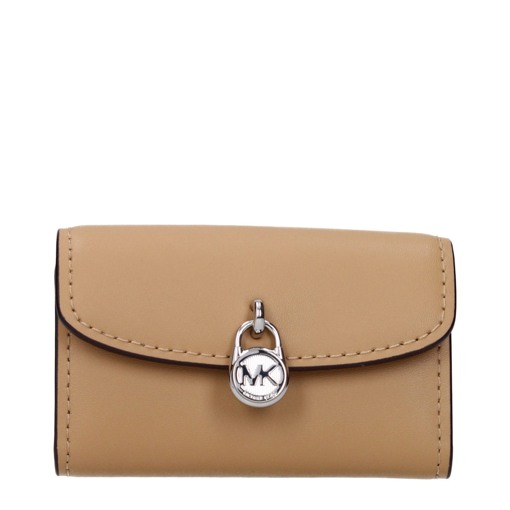Michael Kors brown leather wallet with multiple card slots and a zip coin compartment, designed for stylish organization.