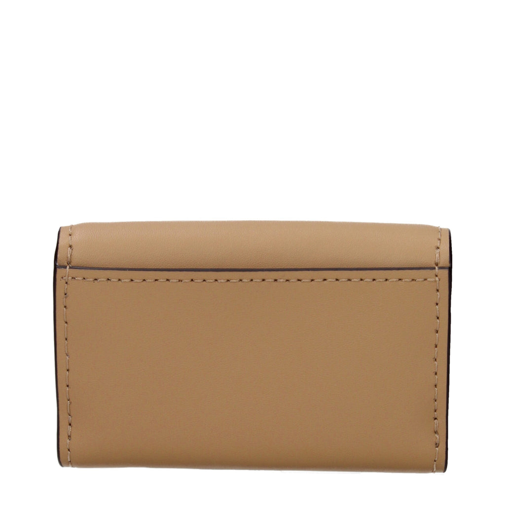 Michael Kors brown leather wallet with multiple card slots and zip coin compartment, stylish and functional accessory.