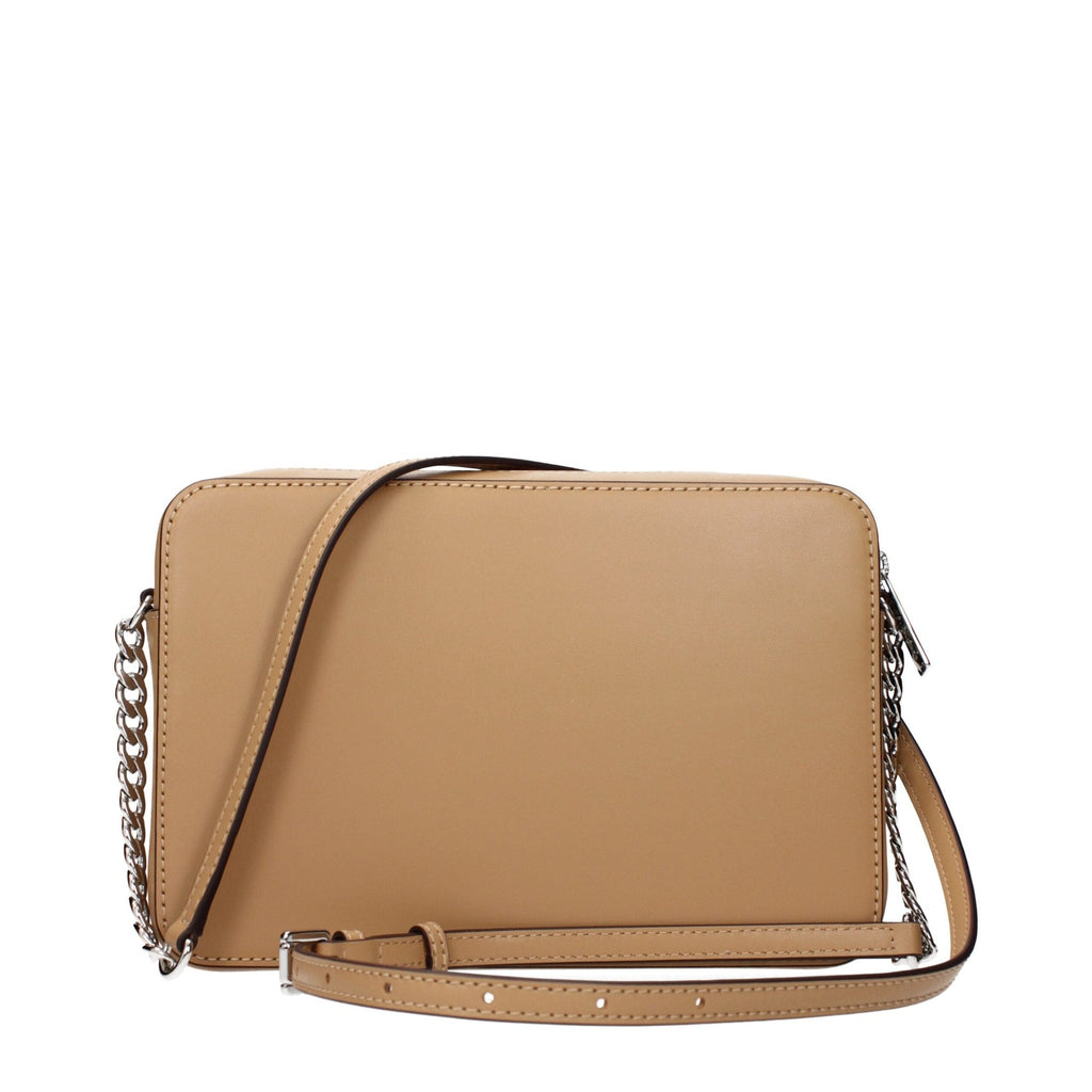 Michael Kors brown leather crossbody bag with gold-tone hardware and adjustable strap, showing front view.
