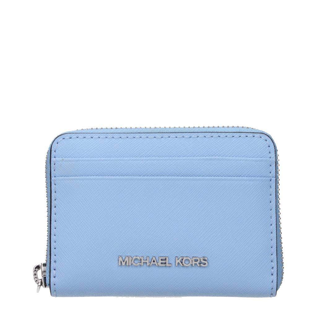 Michael Kors light blue leather cardholder with multiple card slots and sleek design.
