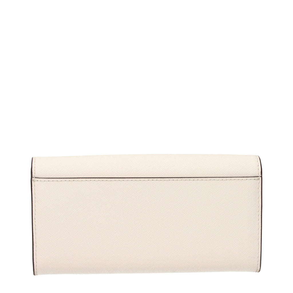 Michael Kors beige leather wallet with multiple card slots and zip coin pocket, stylish and functional accessory.