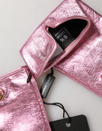Pink leather Dolce & Gabbana DG logo wrist-length mitten gloves with soft lining and stylish design.