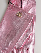Pink leather wrist-length mitten gloves with Dolce & Gabbana DG logo, featuring a stylish and elegant design.