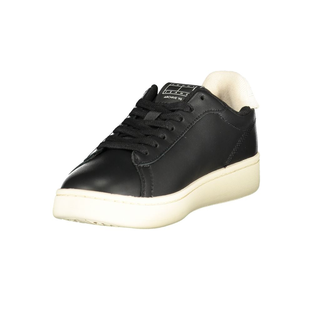 Tommy Hilfiger black women's sneaker with polyurethane upper and white sole, casual athletic footwear.