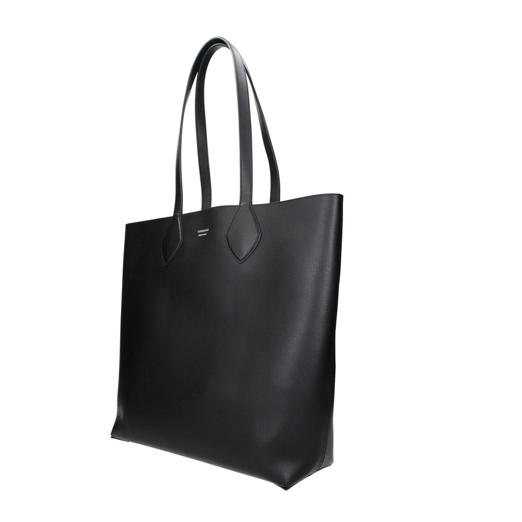 Black leather shoulder bag by Salvatore Ferragamo with gold-tone hardware and adjustable strap, stylish and elegant accessory.