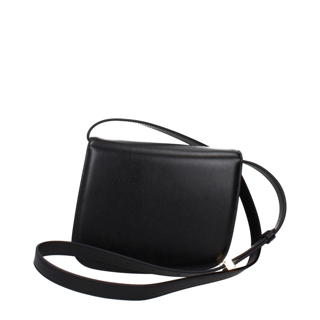 Black leather crossbody bag by Salvatore Ferragamo featuring sleek design and adjustable strap, displayed on a plain background.