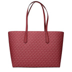 Red fabric shoulder bag by Michael Kors with gold-tone hardware and adjustable strap, featuring a sleek, stylish design.
