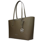 Green fabric shoulder bag by Michael Kors with adjustable strap and sleek design, perfect for everyday use.