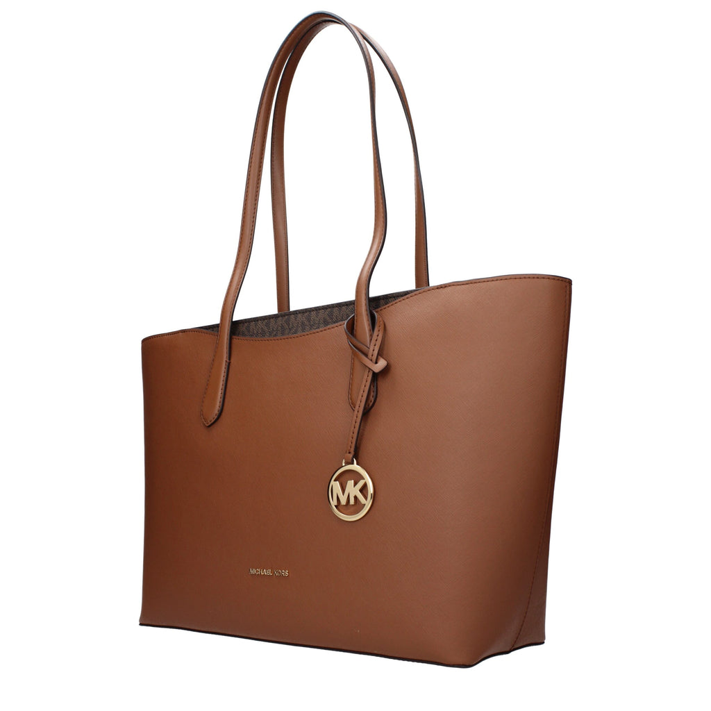 Michael Kors brown leather shoulder bag with gold-tone hardware, featuring adjustable strap and spacious interior.